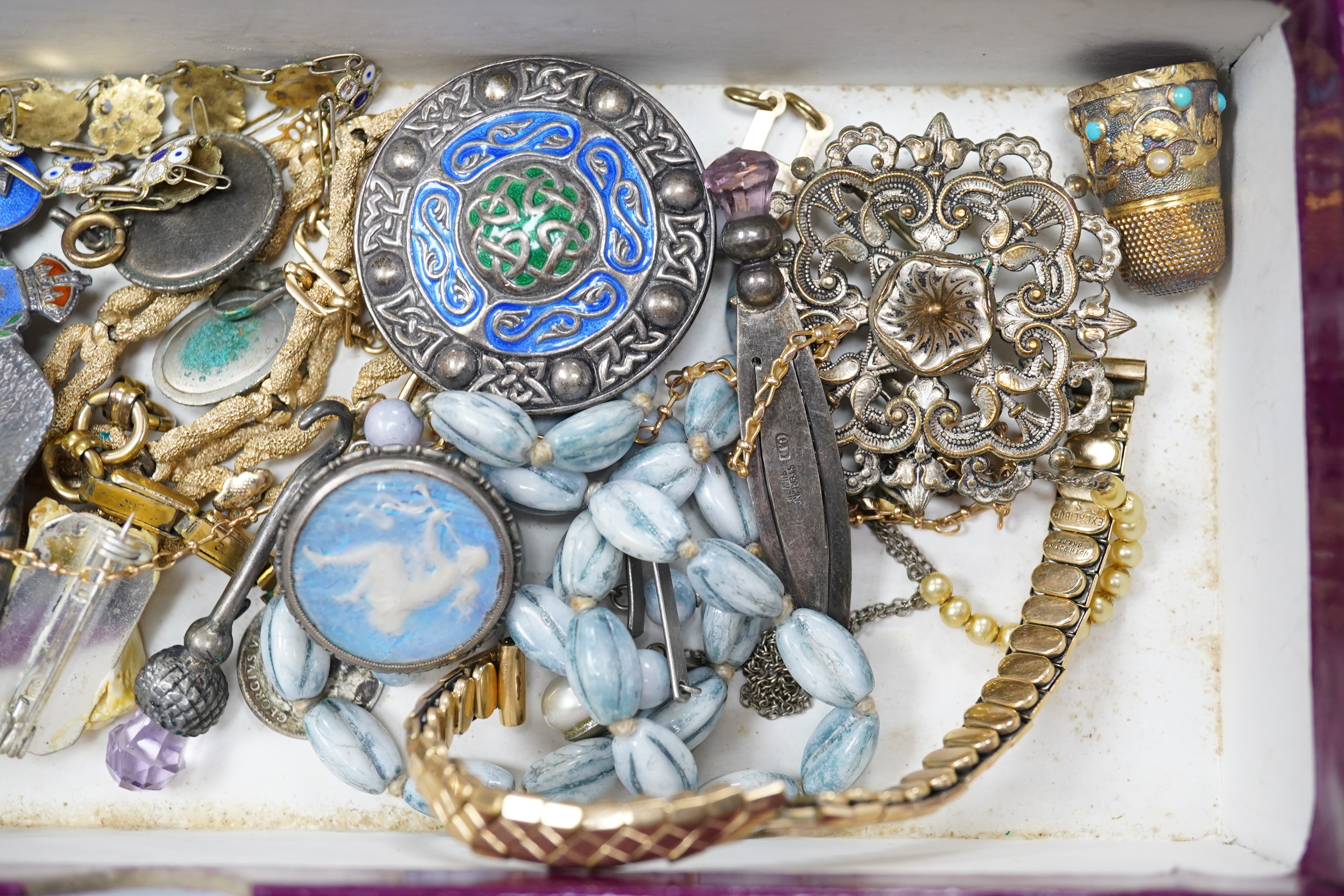 A mixed group of jewellery, including a yellow metal chain stamped 15c, 4.5 grams, a 9ct 'H' charm, a George VI silver and enamel Celtic style brooch, by A H Darby & Son, a sterling book mark, an agate bead necklace and